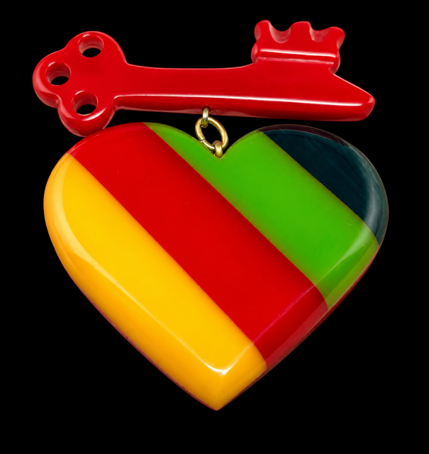 Shultz red/laminated stripes bakelite heart/key pin